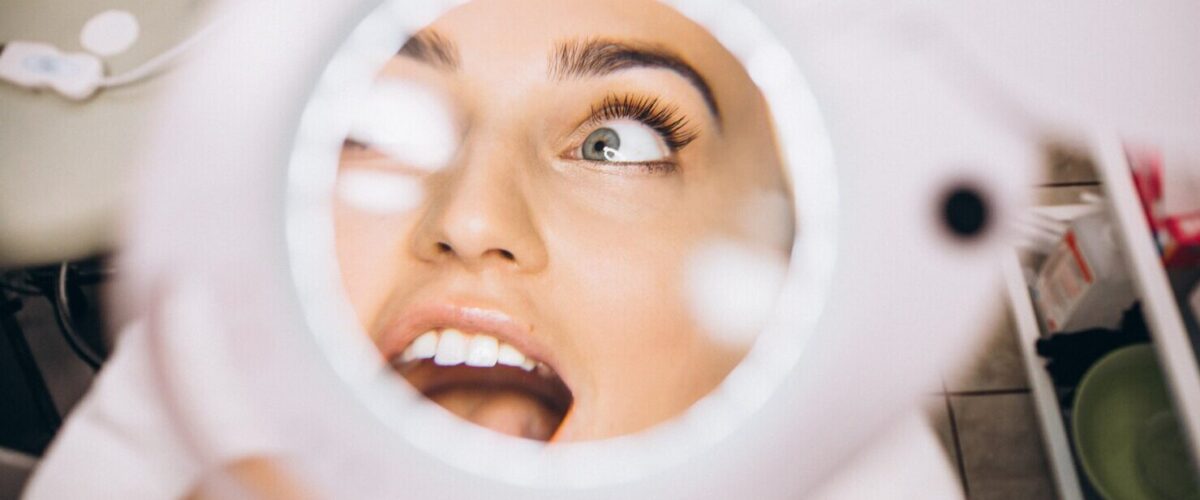 https://www.alfadentclinic.com/en/wp-content/uploads/2024/03/female-face-through-magnifying-lens-beauty-salon_1303-16738-e1711038370683.jpg